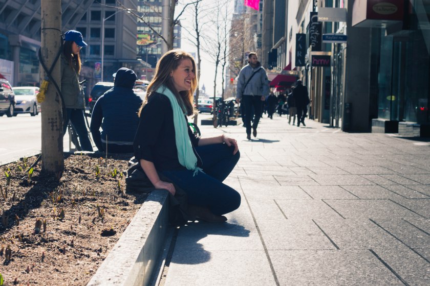 Woman, sitting, sidewalk, toronto, bloor street, yorkville
